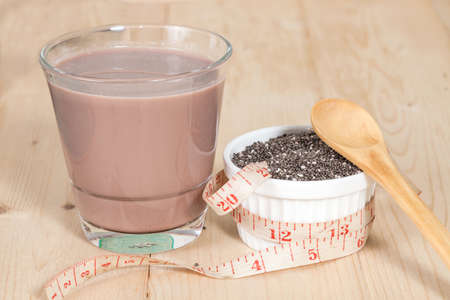 Chia seed with chocolate milk on wood tableの写真素材