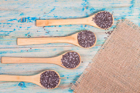 Nutritious chia seeds on a wooden spoonの写真素材