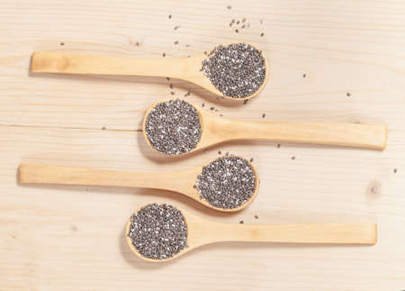 Nutritious chia seeds on a wooden spoonの写真素材