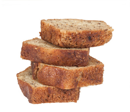 Homemade banana bread sliced on white backgroundの写真素材