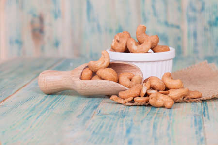 Cashew nuts in wooden spoon.の写真素材
