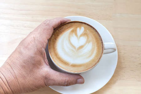 hand holding coffee cup.の写真素材