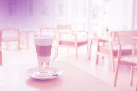 Cup of Hot  Latte Coffee on wood tableの写真素材