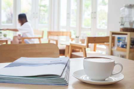 Latte Coffee art on the wooden tableの写真素材