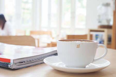 Latte Coffee art on the wooden tableの写真素材