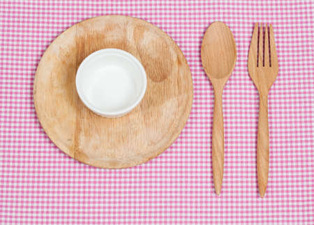 Color tablecloth, spoon, fork on  table backgroundの写真素材