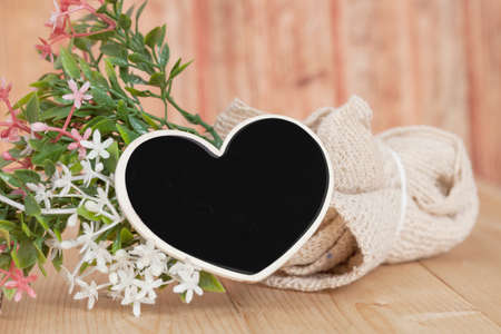 Bouquet of  flowers with wooden heart shape