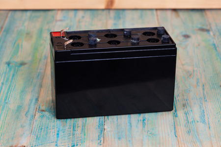 Open Sealed  battery  on wood background ,Seletive focusの写真素材