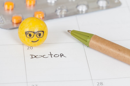 The words Doctor written on a Calendar to Remind you an Important Appointmentの写真素材