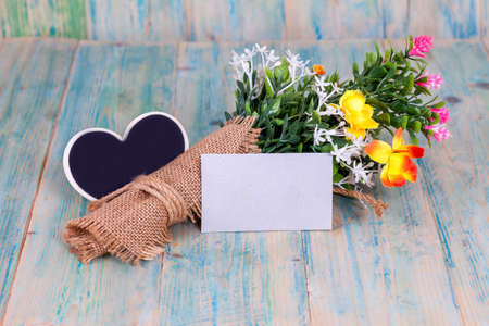 Bouquet of flowers with blank paper tag