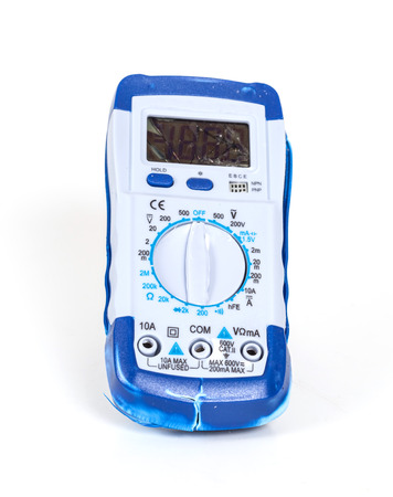broken Digital multimeter on white backgroundの写真素材