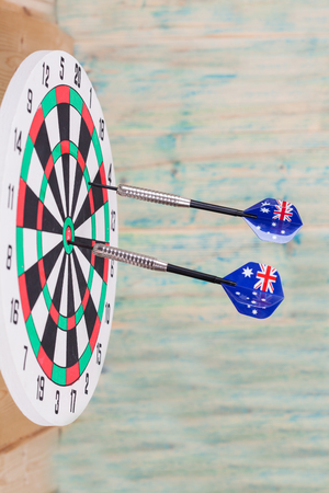 Darts arrow with Australia flags on red dart boardの写真素材