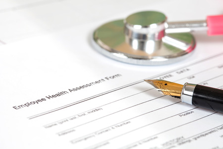 close up employee health assessment form and penの写真素材