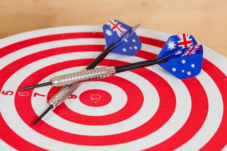 Darts arrow with Australia flags on red dart board , white background
