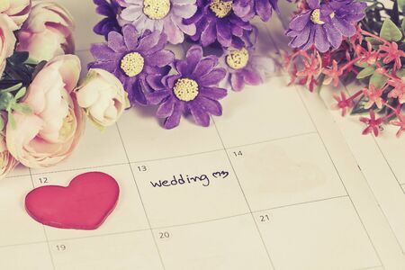 word wedding on calendar with sweet flowers   ,love conceptの写真素材