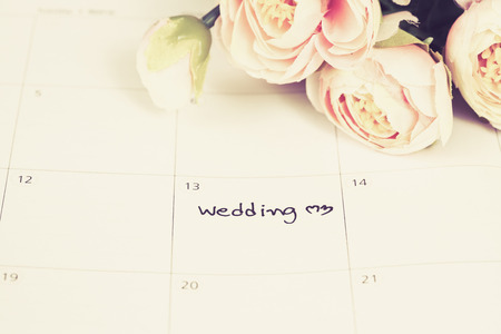 word wedding on calendar with sweet flowers   ,love conceptの写真素材