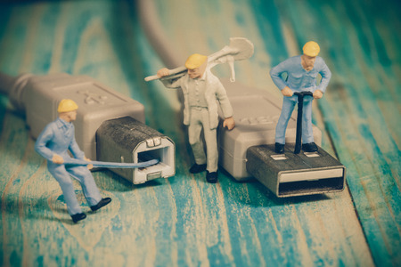 Miniature people working  ,selective focusの写真素材