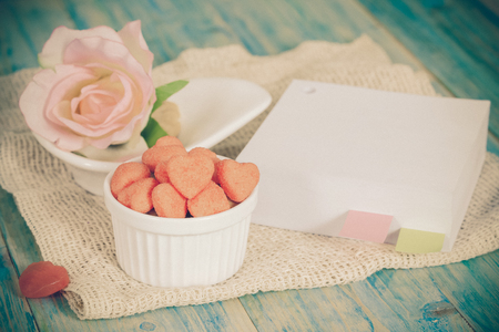 heart candies coated with sugar
with book note ,message paper.selective focus.の写真素材