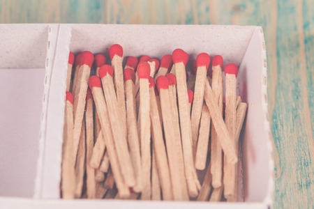 Matchsticks over wooden backgroundの写真素材