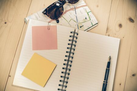 book note with post it on wood backgroundの写真素材