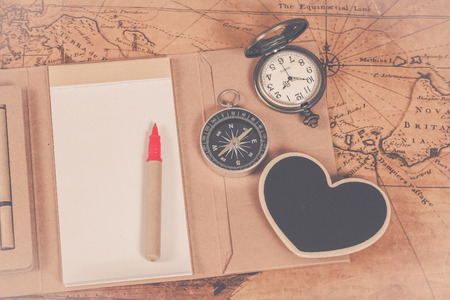 Compass with note book on old map vintage process styleの写真素材