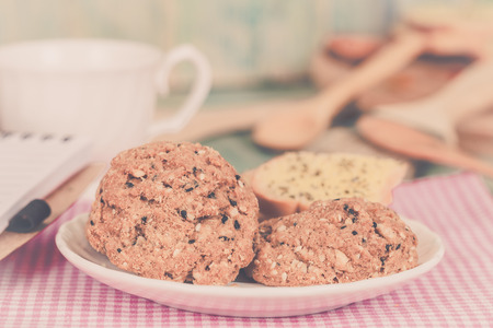 whole Grain cookie with note book On Wood table