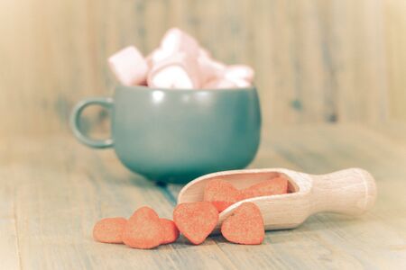 red heart on wooden spoon as symbol of love, valentines and happiness