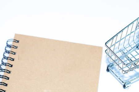 miniature shopping cart on isolate backgroundの写真素材