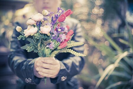 human hold a flower