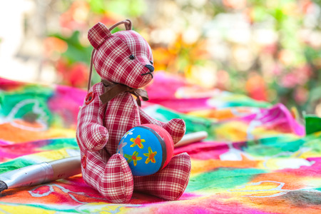 easter egg with bear on colorful paperの写真素材