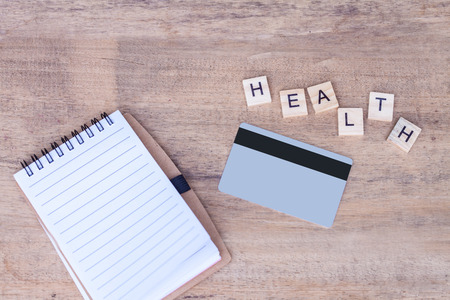 stethoscope  and book note on woodの写真素材