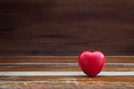 still life red heart on woodの写真素材