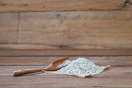 Organic raw sticky rice on wood tableの写真素材