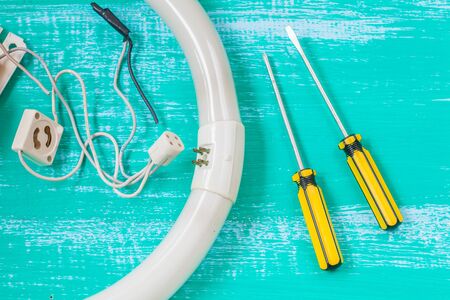 repair fluorescent light and tool on woodの写真素材