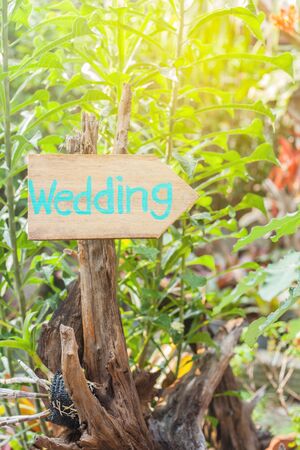 Wooden signboard with the inscription in  paint wedding. Wood hand made wedding decoration table.の写真素材