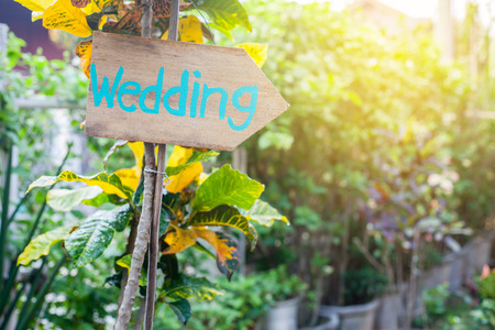 Wooden signboard with the inscription in  paint wedding. Wood hand made wedding decoration table.の写真素材