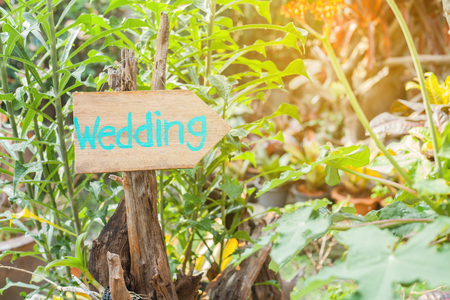 Wooden signboard with the inscription in  paint wedding. Wood hand made wedding decoration table.の写真素材