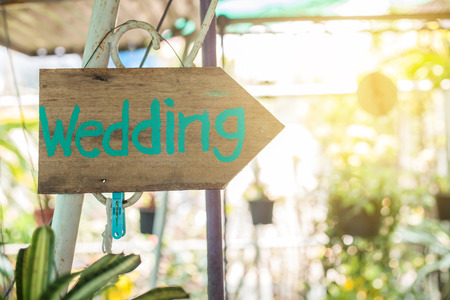 Wooden signboard with the inscription in  paint wedding. Wood hand made wedding decoration table.の写真素材