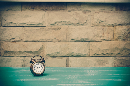 vintage alarm clock on wood