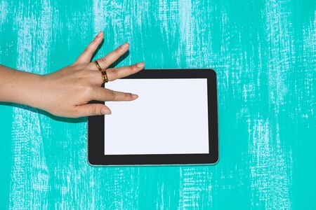 hand hold and touch a tabletの写真素材