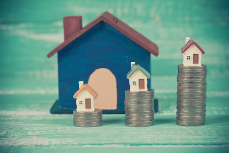 mini house on coin stack or moneyの写真素材