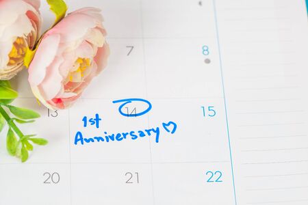 word anniversary celebration plan on calendar with flower