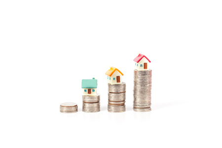 Mini houses on coinの写真素材
