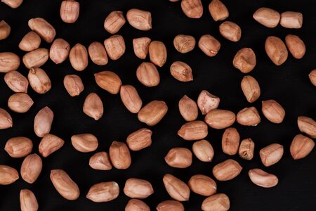 ground nut or peanut on black background