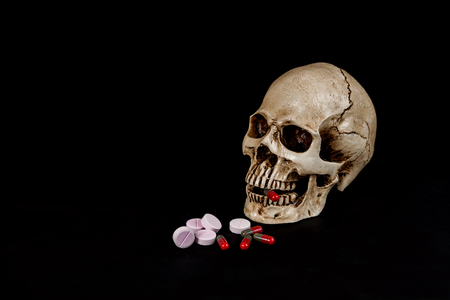 skull with drug or medicine on  blackの写真素材