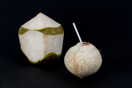 Fresh coconut water on black backgroundの写真素材