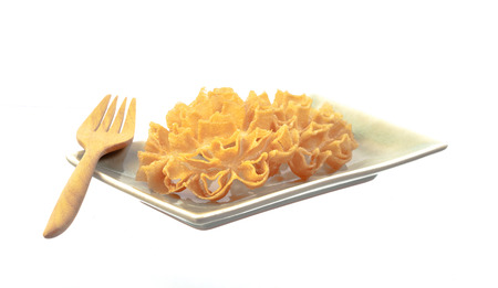 Crispy Lotus Blossom Cookie in dish on white background