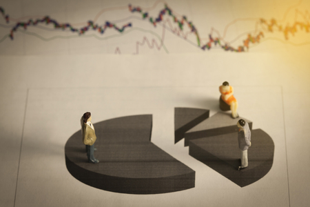 Miniature business man on stock market graph or 
chart,Image for business concept.
の写真素材
