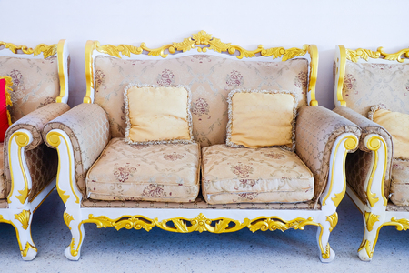 Royal sofa with pillows in beige luxurious interior .の写真素材