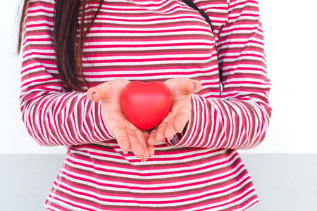 red heart sign in handの写真素材